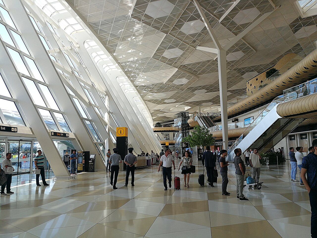 Departures hall with its wooden cocoons at Baku Heydar Aliyev International Airport