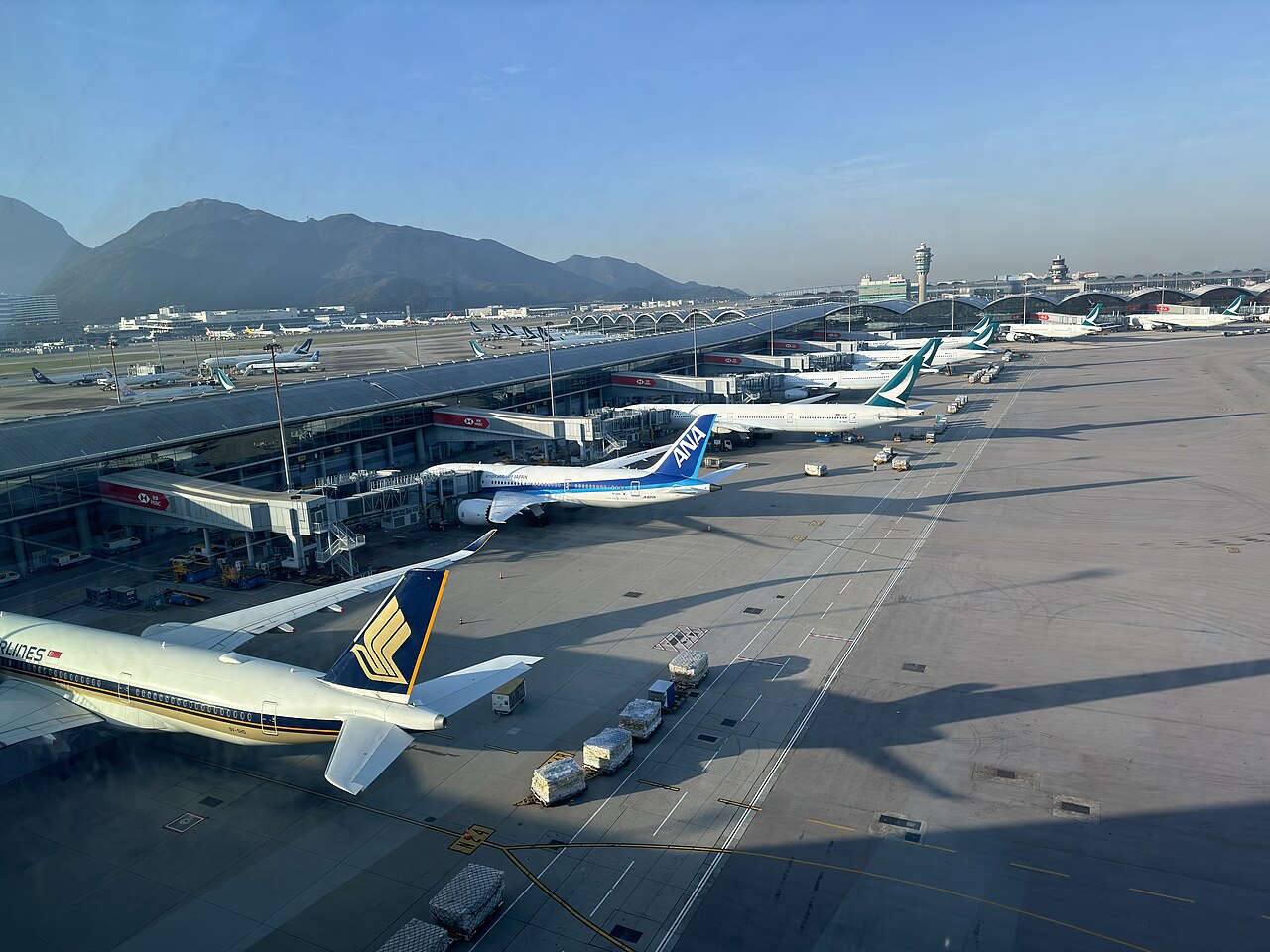 Hong Kong International Airport terminal at dusk