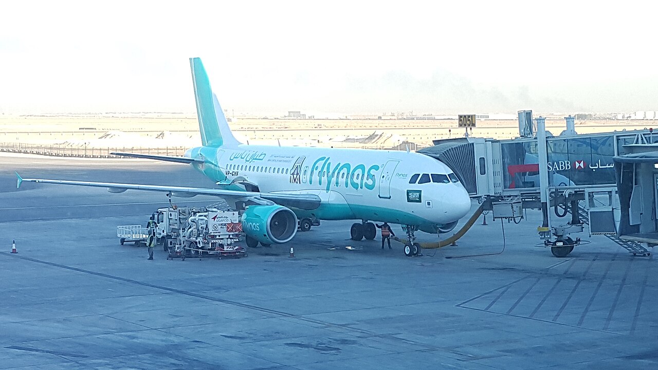 flynas aircraft at a gate at Riyadh King Khalid International Airport